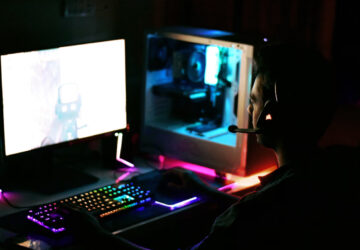 Gamer using advanced strategies in a futuristic first-person shooter game in 2025