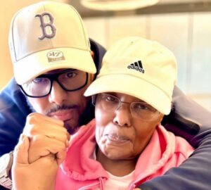 Al B. Sure! smiling beside his mother, Rev. Cassandra Mack-Brown, sharing a heartfelt moment together before her passing.