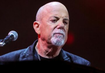 Billy Joel performing live before canceling his tour due to normal pressure hydrocephalus diagnosis.